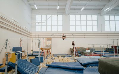 A training space with a mat and minimalist equipment.